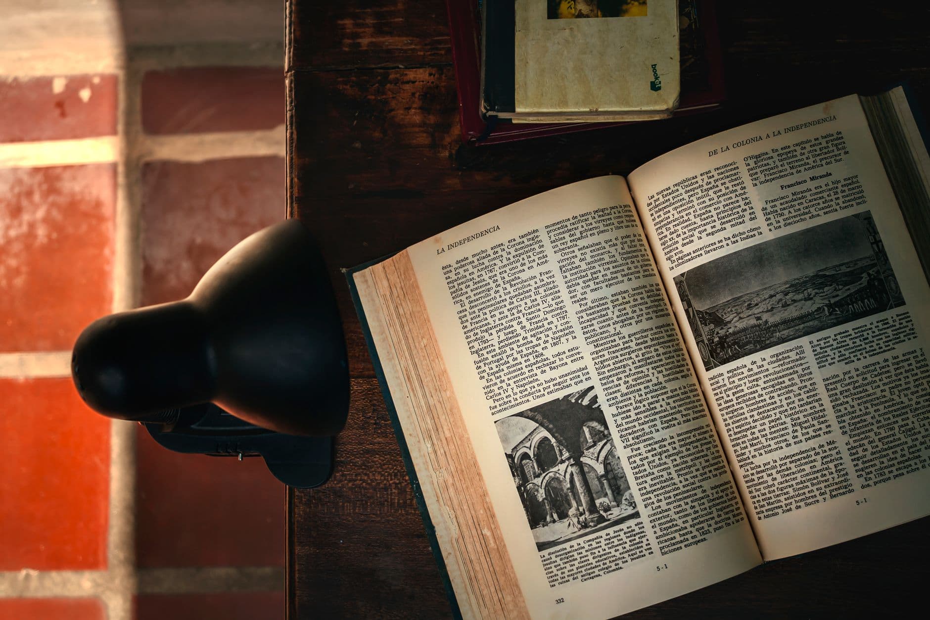 An open book by lamplight